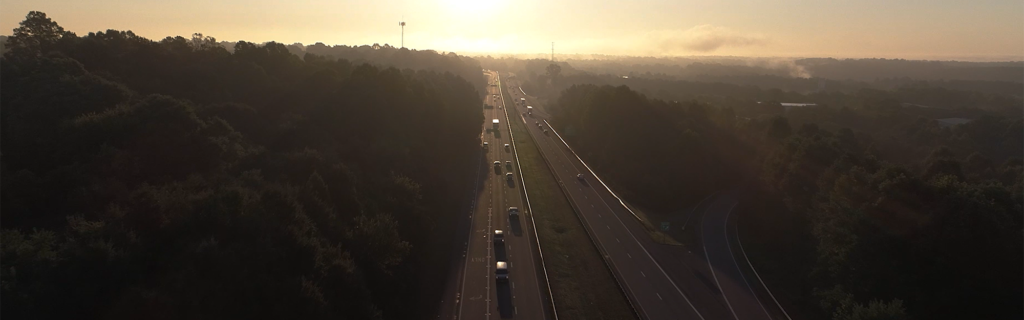 Drone shot of highway at sunset